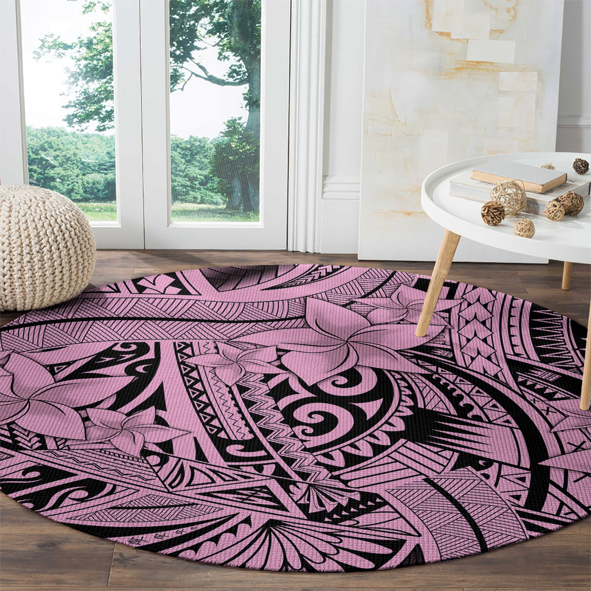 Round pink tribal floor rug with ornate swirl center and geometric border in black and purple