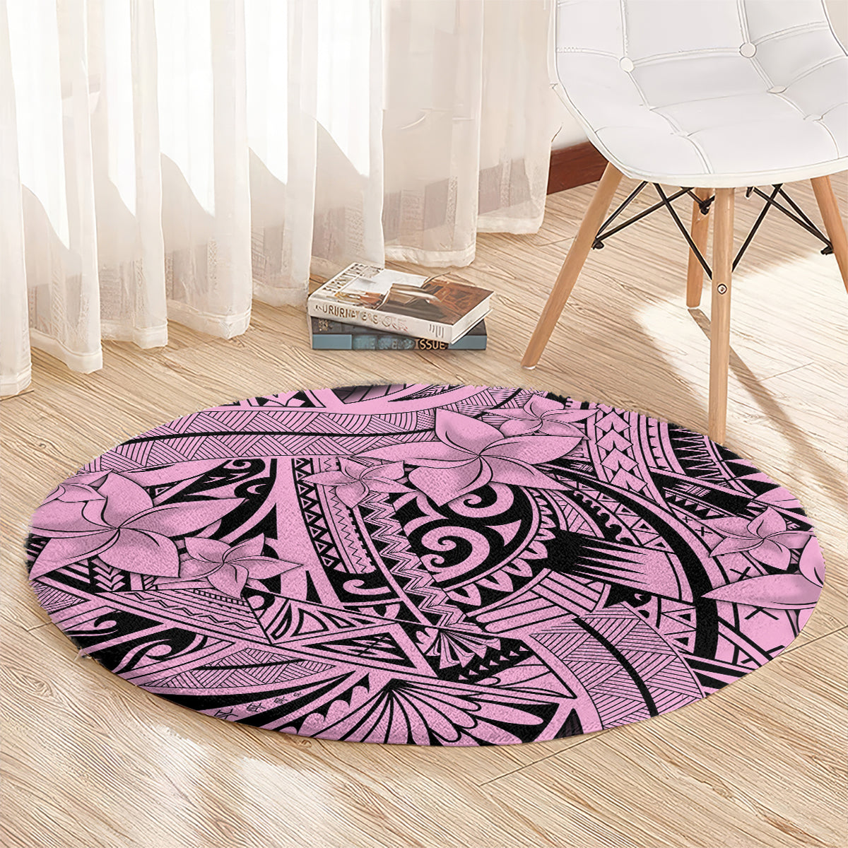 Round pink tribal area rug with floral arches and black geometric detailing