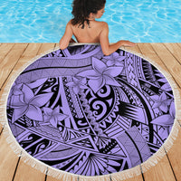 Fringed round violet beach blanket with tribal swirl and flower motifs.