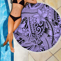 Round violet beach blanket close-up with tribal geometric lines, floral prints, white fringe.