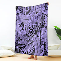 Violet tribal blanket with floral and geometric patterns, draped over bed