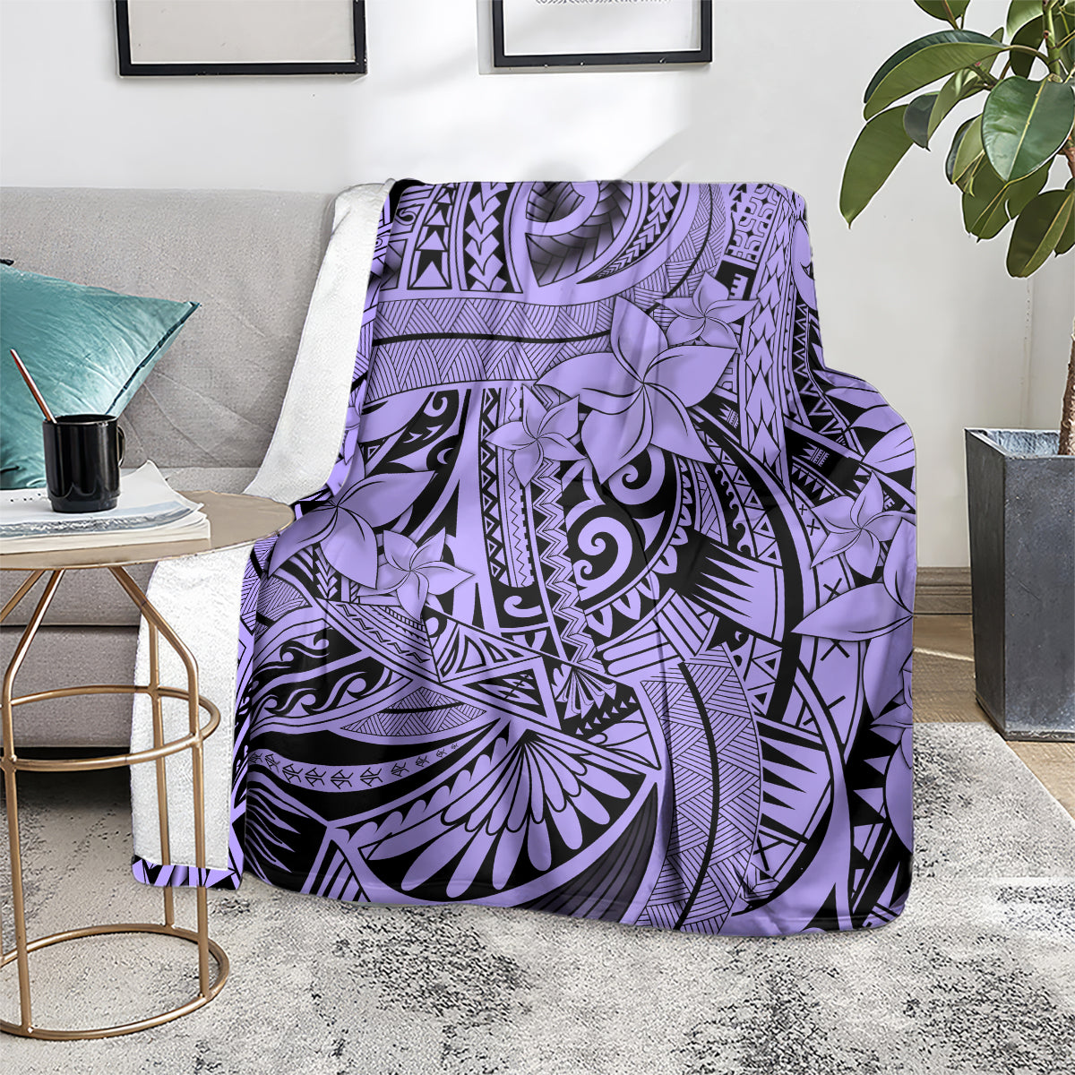 Violet tribal blanket with floral and geometric design, folded on a couch