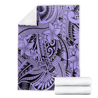 Violet tribal blanket with floral geometric patterns, folded with white towels