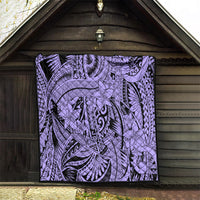 Violet tribal quilt hung on a wooden wall, black-and-violet floral and tiki-style motifs