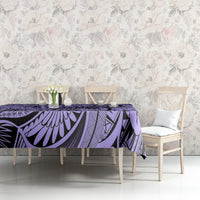 Violet tablecloth with black tribal floral pattern covering dining table