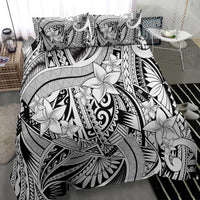 Black-and-white tribal duvet cover featuring big white floral motifs and pillowcases
