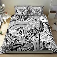 Black-and-white tribal bedding set with white flower pattern and two matching pillowcases