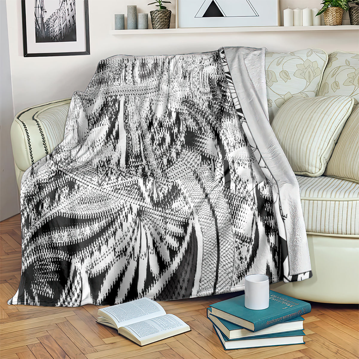 Black and white tribal floral blanket over a couch with a soft drape