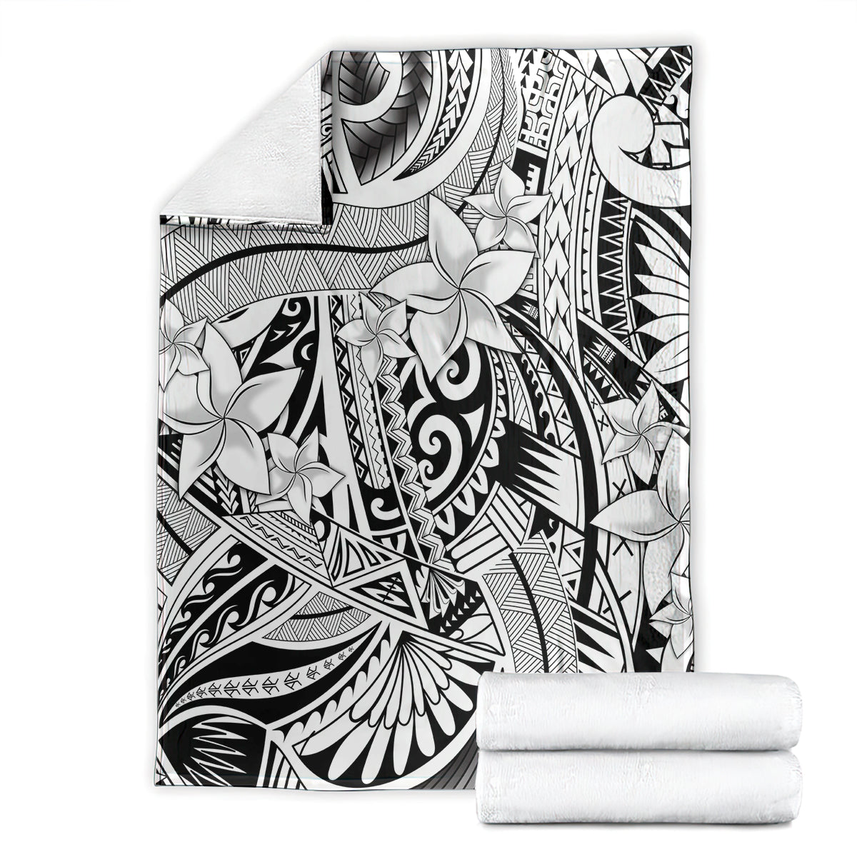 Black and white tribal floral blanket stacked with folded white rolls
