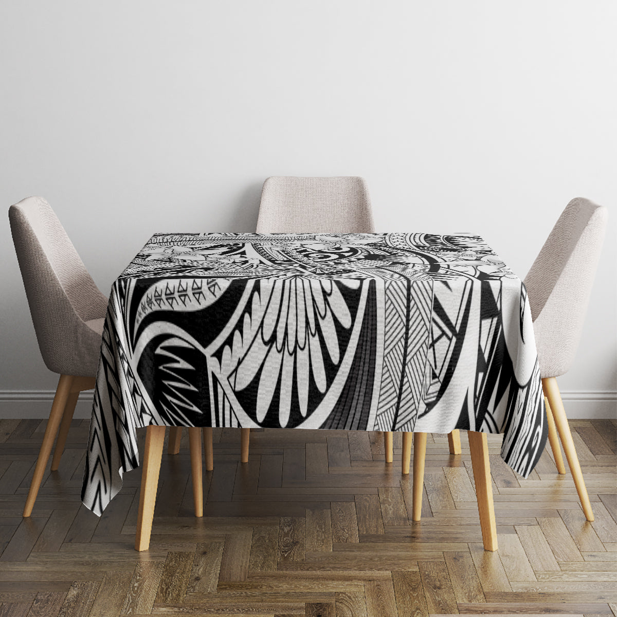 Tribal tablecloth with bold black-and-white tiki motifs, neatly covering dining table