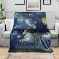 Goat starry night throw blanket with goat portrait, blue and yellow stars, on gray sofa
