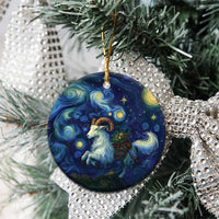 Close-up of blue round ceramic goat starry night ornament with gold hanging loop