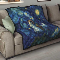 Dark blue starry night quilt on a gray sofa, featuring goat and glowing stars