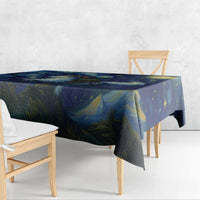 Rectangular starry night tablecloth draped over table edge in blue and gold