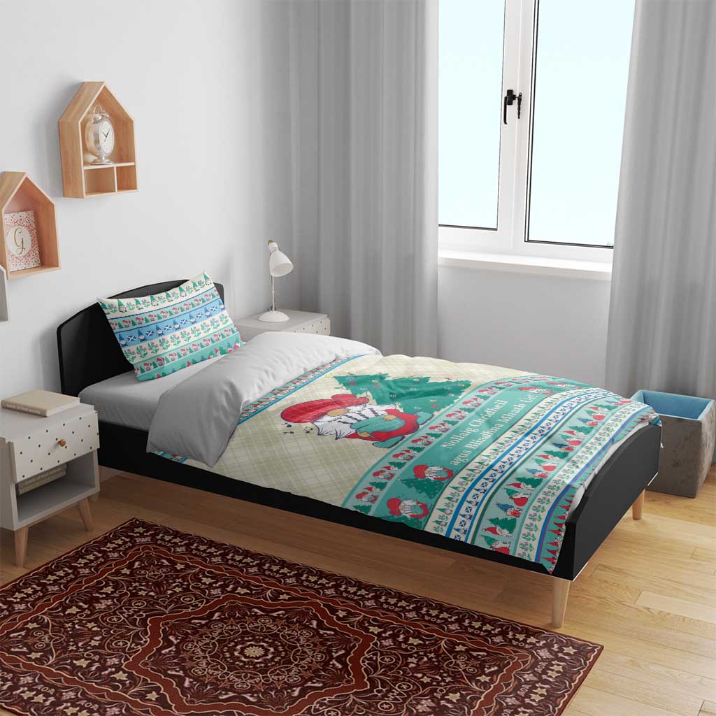 Christmas gnome bedding set on a bed with off-white base and mint blue patterned trim