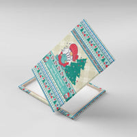 Angled gnome canvas wall art showing Christmas tree, red bird, and teal gift