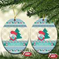 Pair of round ceramic Christmas ornaments with gnome illustration and blue border, hanging