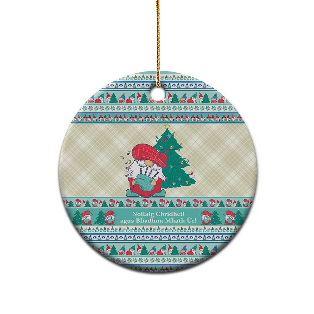 Round ceramic ornament with gnome scene, Gaelic-style text band, gold hanging loop