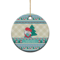 Round ceramic ornament with gnome scene, Gaelic-style text band, gold hanging loop
