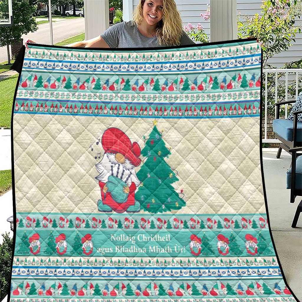 Christmas musical quilt blanket with snowman and green tree, white quilted center, mint blue trim