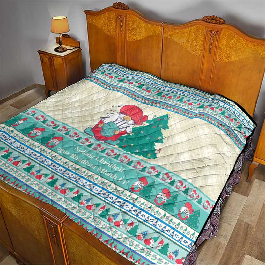 Quilted Christmas bedspread blanket with snowman and green tree motif in mint blue