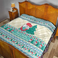 Quilted Christmas bedspread blanket with snowman and green tree motif in mint blue