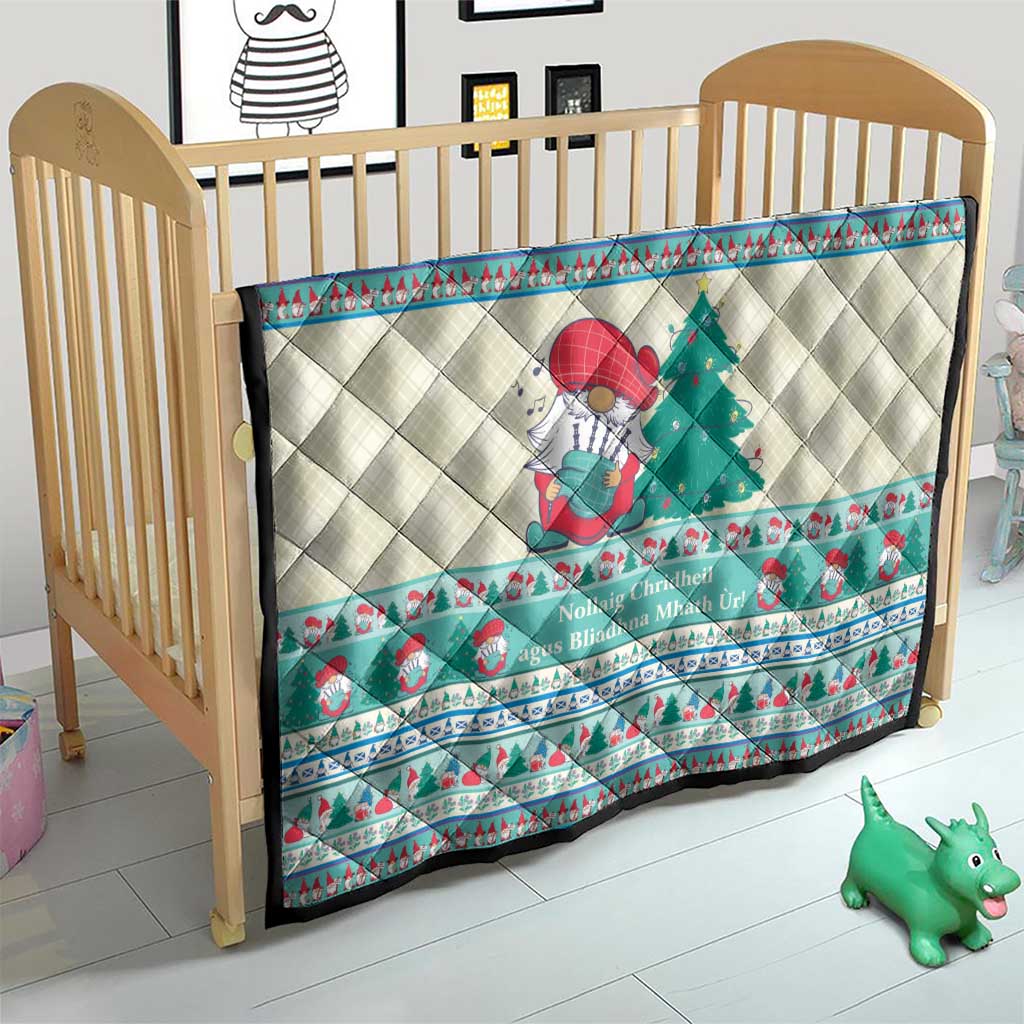 Quilted Christmas crib blanket with snowman and tree artwork and mint blue border