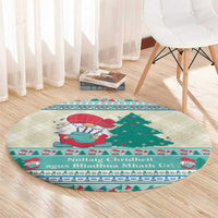 Round Christmas carpet with mint blue trim, gnome and tree scene, and bold decorative band