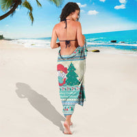Christmas gnome sarong, cream ground with teal-blue border and festive character print