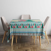 Rectangular Christmas gnome tablecloth in mint blue with red and green tree stripe border.