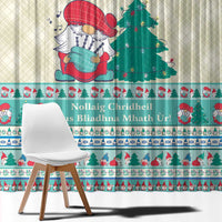 Christmas curtain panel with large gnome in red hat, pine tree, and mint blue border