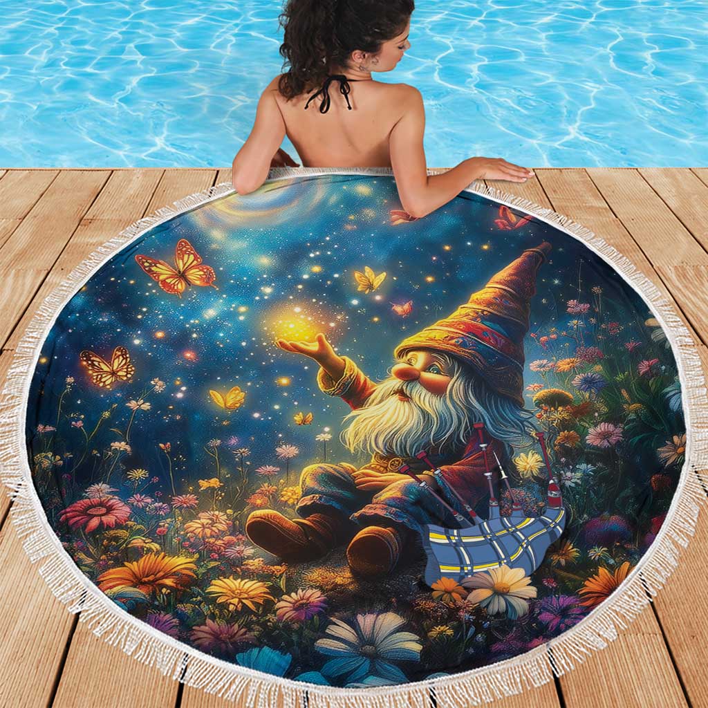 Round fringed beach blanket with starry-night gnome, flowers and butterflies, in use