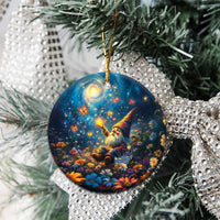 Close-up of blue ceramic round ornament with Scottish gnome and starry night, gold loop
