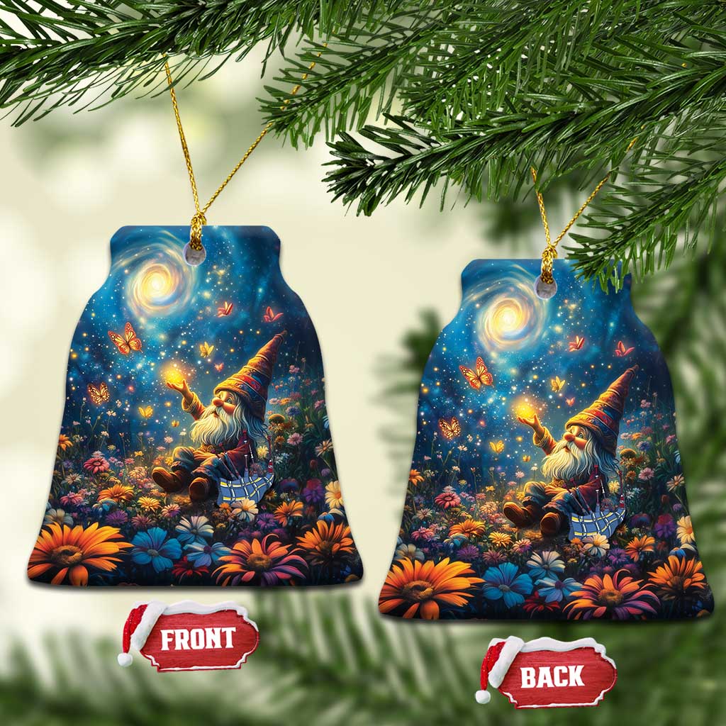 Blue ceramic bell-shaped ornament with Scottish gnome scene and gold hanging loop