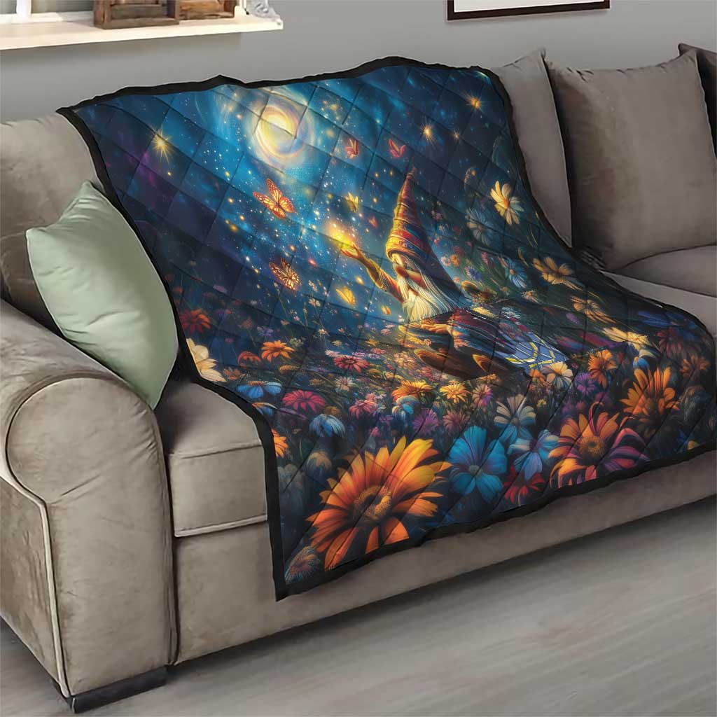 Blue quilt blanket with starry angel scene and vibrant orange floral accents