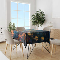 Tablecloth with dark navy and orange floral print, draped over dining table