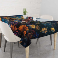 Dark navy tablecloth with bold orange and blue floral pattern on dining table