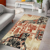 Beige rectangular area rug with red, black, and cream tribal and palm motifs