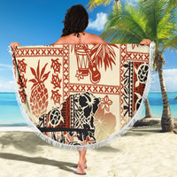 Beige round beach blanket draped with red and black tribal animal print and white fringe