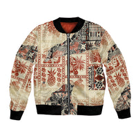 Beige unisex bomber jacket with full-zip front and multicolor tribal patchwork design.