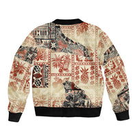 Beige bomber jacket with multicolor tropical tribal pattern on the back, ribbed hem.