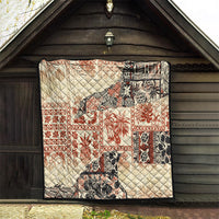Beige aloha tribal quilt with red, black, and white patchwork panels, quilted diamond stitching