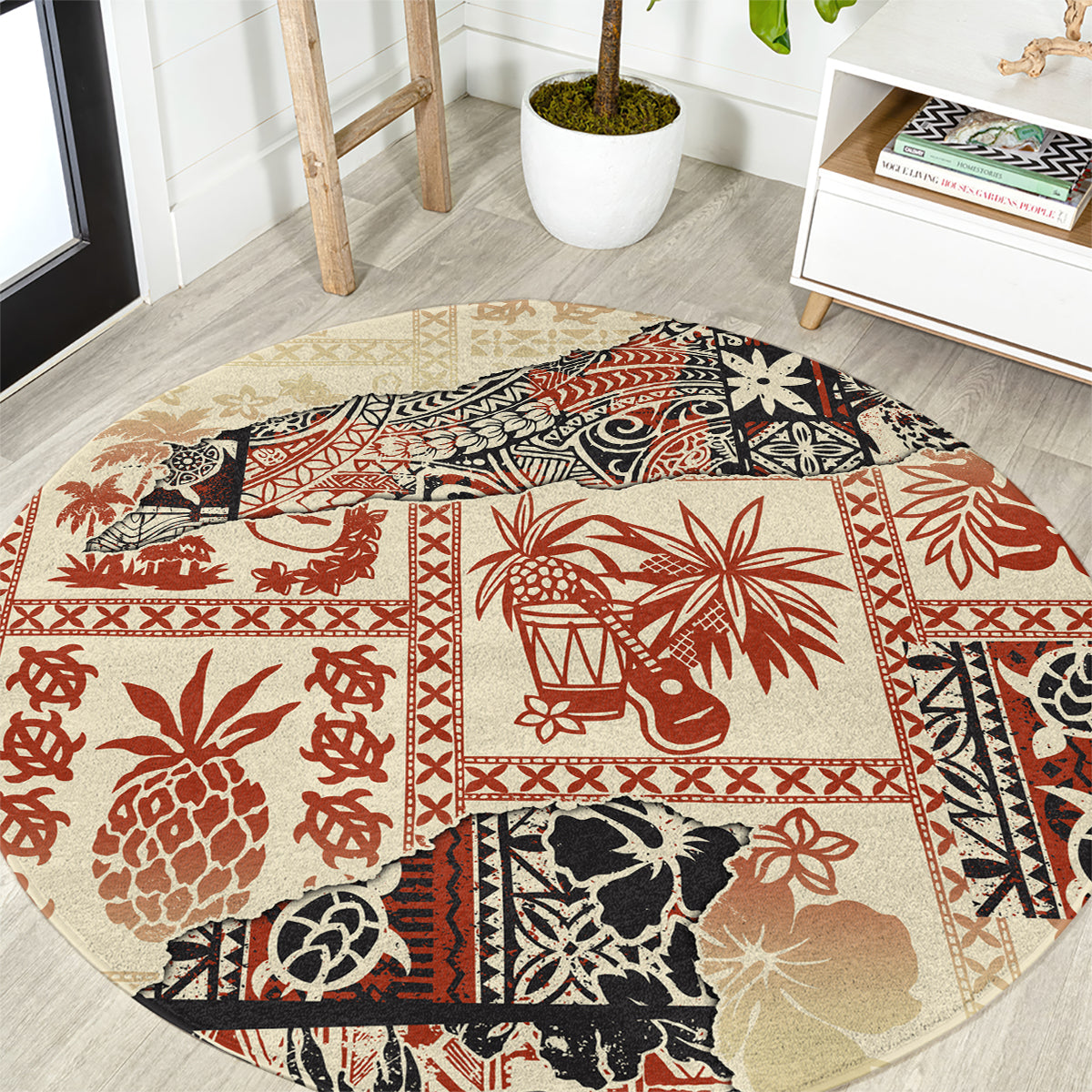 Beige round area rug with red, black, and cream Aloha tribal print border