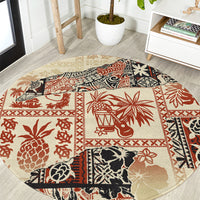 Beige round area rug with red, black, and cream Aloha tribal print border