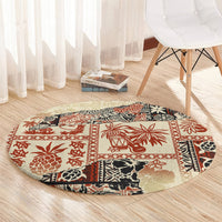 Beige circular rug with red and black tropical tribal motifs on floor