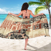 Beige tribal print sarong wrap with red and black animal and leaf patterns