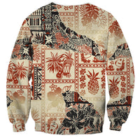 Beige crewneck sweatshirt with long sleeves, large tribal Aloha graphic on back