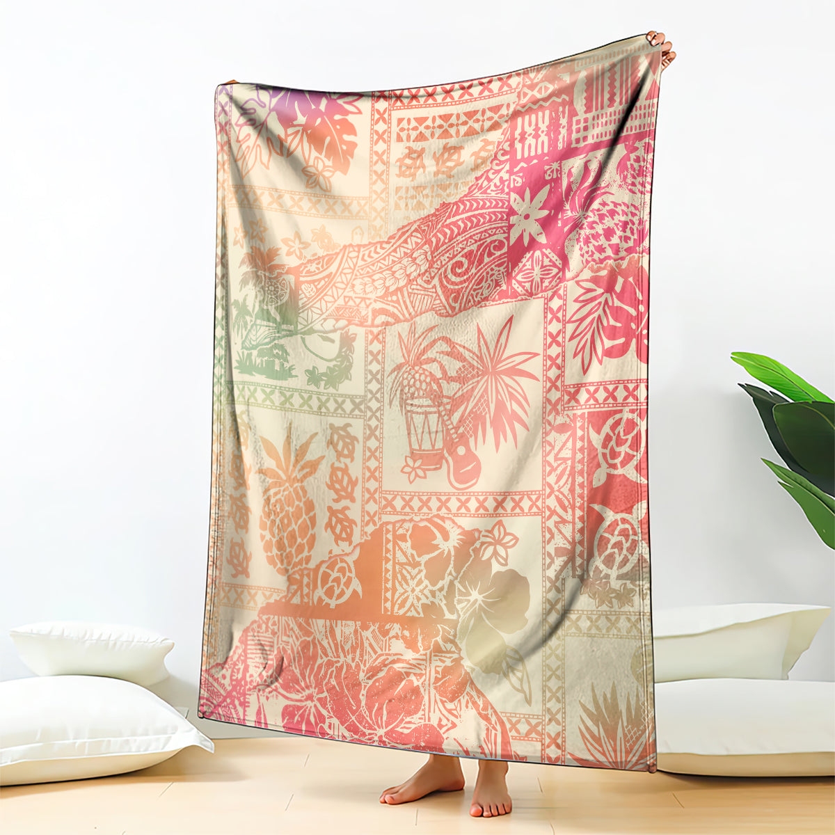 Pink ombre tropical patterned blanket, draped with floral and tiki motifs
