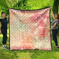Hawaiian quilt blanket with pink and cream ombre tribal pattern, black-edge border, diamond quilt