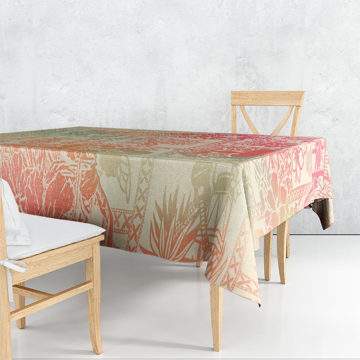 Hawaii tablecloth draped over dining table with pink and cream tribal print